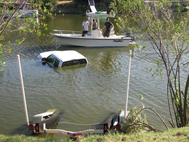 Truck with trailer roll into water at East Port